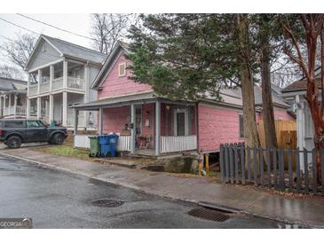 Brick home with front porch and small yard at 613 Mc Donald Se St, Atlanta, GA 30312