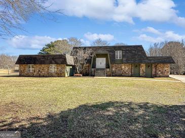 Ranch style home with stone facade and large yard at 107 Stratford Ct, Peachtree City, GA 30269