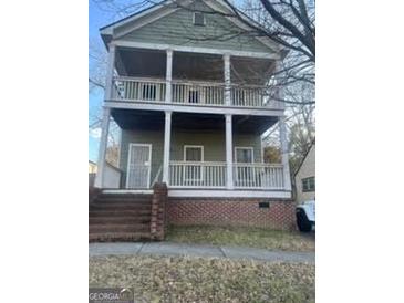 Two-story house with front porch and steps at 996 Desoto Nw St, Atlanta, GA 30314