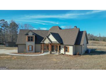 Two-story house with stone accents and a large front porch at 1689 Nebo Rd, Dallas, GA 30157