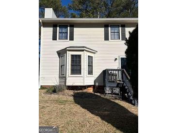 Two-story house with white siding, black shutters, and a deck at 112 Jennifer Sw Ln, Marietta, GA 30060