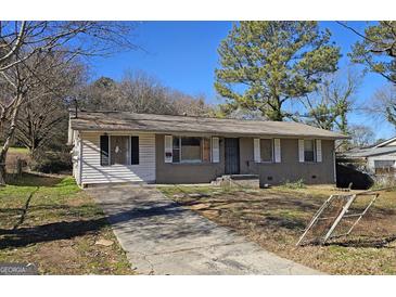 Ranch style home with a brick facade and a spacious yard at 5173 Kingswood Cir, Atlanta, GA 30349