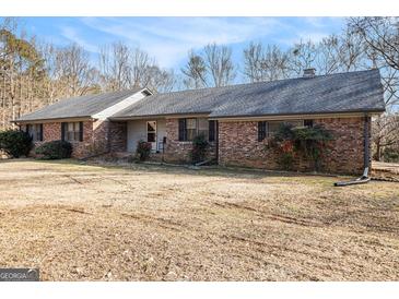 Brick ranch house with a large yard at 255 Barnett Road Rd, Hampton, GA 30228