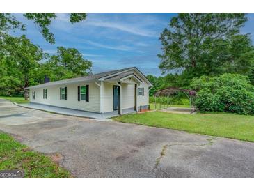 Ranch home with carport and spacious yard at 1198 E Atlanta Rd, Stockbridge, GA 30281