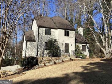 Two-story house with stucco exterior, stone accents, and a spacious lawn at 3536 Evans Ridge Trl, Atlanta, GA 30340