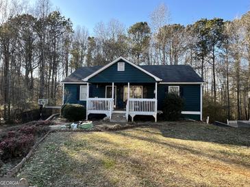 Ranch style home with a covered porch and a large backyard at 177 Villa Rosa Way, Temple, GA 30179