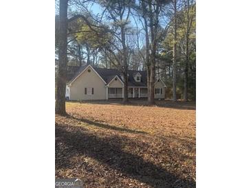 Charming single-Gathering home with a well-maintained lawn and a welcoming front porch at 1091 Harbins Rd, Dacula, GA 30019