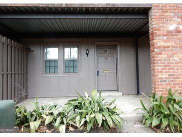 Charming front entrance with a gray door and well-maintained landscaping, giving a welcoming feel at 3083 Colonial Way # N, Atlanta, GA 30341