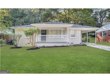 Charming single-story home with a welcoming front porch and a well-manicured lawn at 191 Florida Sw Ave, Atlanta, GA 30310