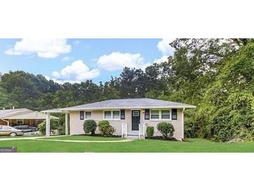 Charming ranch-style home with a well-manicured lawn and beautiful landscaping at 4250 Utoy Sw Ct, Atlanta, GA 30331