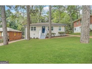Charming single-story home features a well-manicured front yard and inviting entryway at 2193 Polar Rock Sw Ave, Atlanta, GA 30315