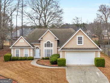 Charming single-Gathering home with manicured lawn, two-car garage and traditional architectural style at 506 Olivia Ct, Stockbridge, GA 30281