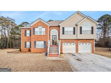 Charming two-story home with a brick facade and a two-car garage offering great curb appeal at 4066 Lions Gate, Douglasville, GA 30135