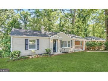 Charming single-story home with a well-maintained front yard and classic architectural details at 2174 Doris Dr, Decatur, GA 30034