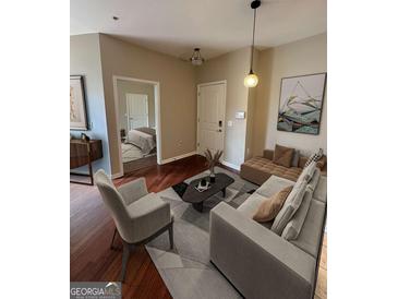 Inviting living room features stylish furniture, modern lighting, and access to a bedroom at 870 Nw Mayson Turner Nw Rd # 1227, Atlanta, GA 30314