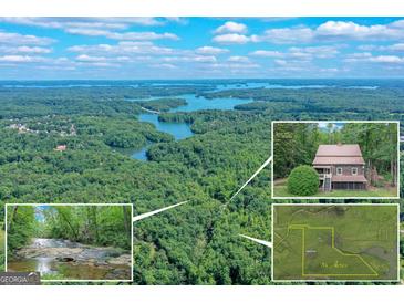 Stunning aerial view of the lakefront property with house, waterfall, and 34 acres of lush landscape at 5200A Burruss Mill Rd, Cumming, GA 30041