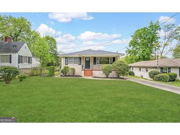 Charming single-story home with a well-maintained lawn and inviting curb appeal at 128 Sewanee Nw Ave, Atlanta, GA 30314
