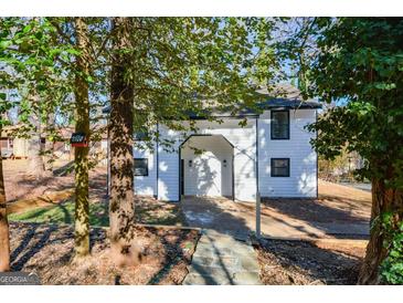 Inviting two-story home with updated exterior and attractive landscaping at 1314 N Lea Se Ct, Smyrna, GA 30080