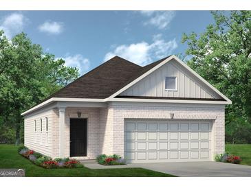 Charming single-story home featuring a brick facade, attached garage, and inviting landscaping at 10458 Trellis Lane (Lot 40), Hampton, GA 30228