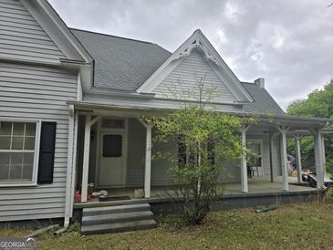 Inviting front porch with classic columns and detailed gable, perfect for relaxing at 2171 Highway 42 S, Mcdonough, GA 30253
