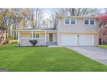 Charming home with a well-manicured lawn and a two-car garage at 2270 Titan Ridge Dr, Decatur, GA 30035