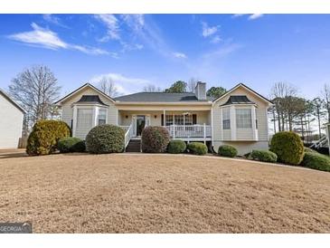 Charming single-story home featuring a well-manicured lawn and inviting entrance at 391 Hickory Lake Dr, Acworth, GA 30101