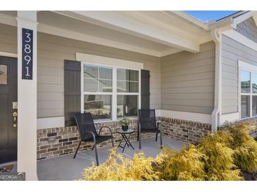 Charming front porch with seating area, perfect for enjoying the outdoors at 3891 Shelleydale Dr, Powder Springs, GA 30127