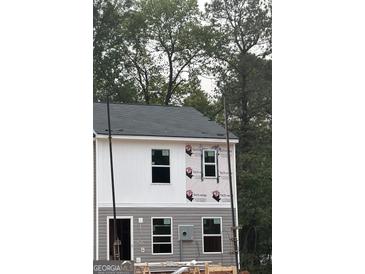 New construction home featuring gray and white siding with black roof and window frames at 7236 Crestside Dr # 80, Austell, GA 30168