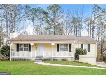 Charming single-story home with a inviting front porch and well-maintained lawn at 117 Parkway Ct, Dallas, GA 30157