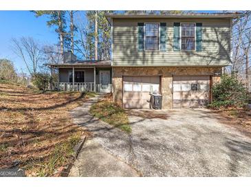 Charming split-level home with stone accents and a two-car garage at 4847 Royal Dr, Duluth, GA 30096