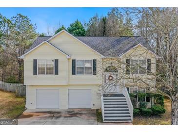 Charming two-story home with a well-maintained front yard and an attached two-car garage at 362 Summer Hill Cir, Stockbridge, GA 30281