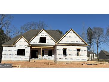 New construction home featuring a gabled roof and framed windows ready for finishing at 349 Lowbrooke Ct # 19, Fairburn, GA 30213