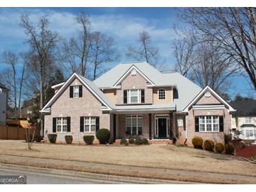 Charming brick home with a well-manicured lawn and beautiful landscaping at 2920 Stanway Ave, Douglasville, GA 30135