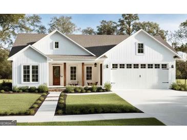 Charming white farmhouse-style home with a well-manicured lawn and a welcoming front porch at 110 E Ranchette Rd, Temple, GA 30179