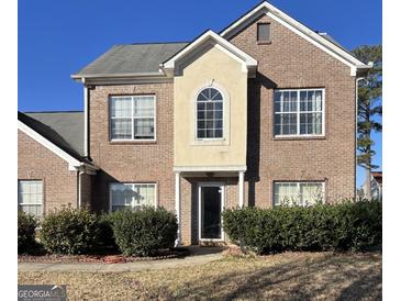 Charming two-story brick home with a well-maintained front yard, perfect for families at 10467 Tara Beach Cir, Jonesboro, GA 30238
