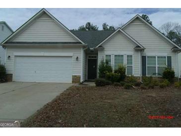 Charming one-story home with a two-car garage and well-maintained landscaping at 358 Southgate Dr, Locust Grove, GA 30248