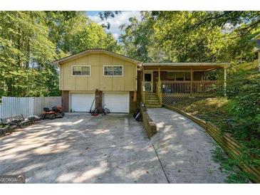Split level home with two car garage and covered front porch at 6226 Lullwater Dr, Douglasville, GA 30135