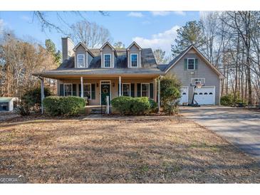 Charming single-Gathering home featuring a welcoming front porch and attached two-car garage at 9209 W Banks Mill Rd, Winston, GA 30187