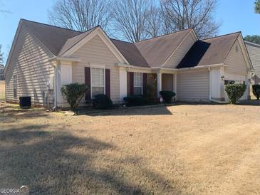 Charming single-story home with a well-manicured lawn and neutral-colored siding at 4019 Pin Oak Trl, Decatur, GA 30034
