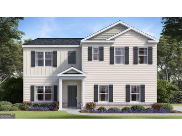 Charming two-story home with a well-manicured lawn and inviting front entrance at 362 Friendship Oak Way, Hampton, GA 30228