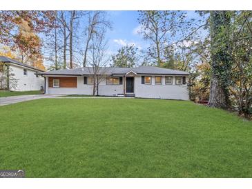 Charming single-story home with a well-manicured lawn and inviting curb appeal at 2378 Green Forrest Dr, Decatur, GA 30032