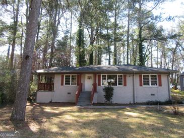 Charming single-story home with red shutters and landscaped front yard at 1876 Sw Sandtown Sw Rd, Atlanta, GA 30311