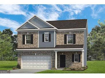 Charming two-story brick home with gray accents and a manicured lawn under a bright sky at 10410 Trellis Lane (Lot 35), Hampton, GA 30228