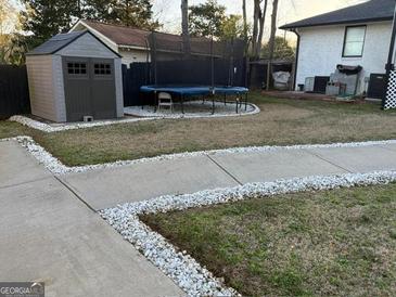 Backyard with storage shed and a trampoline offering outdoor recreation at 4100 Scott S Dr # 0, Forest Park, GA 30297