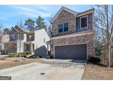 Charming two-story home with brick and siding exterior and a two-car garage at 88 Hardy Water Dr, Lawrenceville, GA 30045