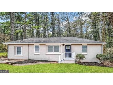 Charming single-story home featuring a welcoming entrance and lush front lawn at 2194 Loring Ct, Decatur, GA 30032