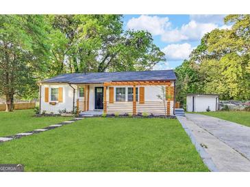 Charming home with a well-manicured lawn, complemented by modern shutter details at 230 Argus Cir, Atlanta, GA 30331