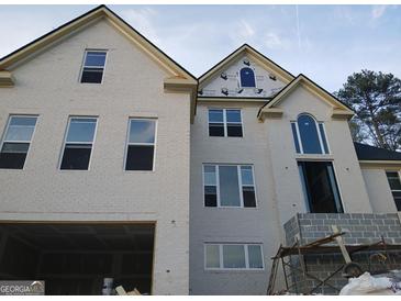 A beautiful, two-story, newly constructed house with large windows and brick exterior at 2910 Battlecrest Dr, Decatur, GA 30034