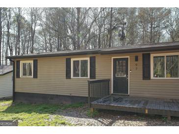 Charming single-story home features a covered front porch and neutral siding at 97 College St, Temple, GA 30179