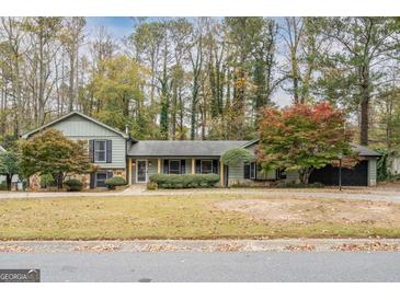 Charming single-Gathering home with well-maintained landscaping and mature trees at 2431 Weatherford Ct, Marietta, GA 30068